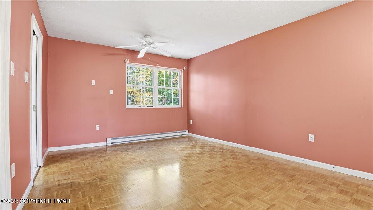 349 Bumble Bee Pass Cresco, PA 18326 - Photo 51 of 109 an empty room with windows and chandelier fan