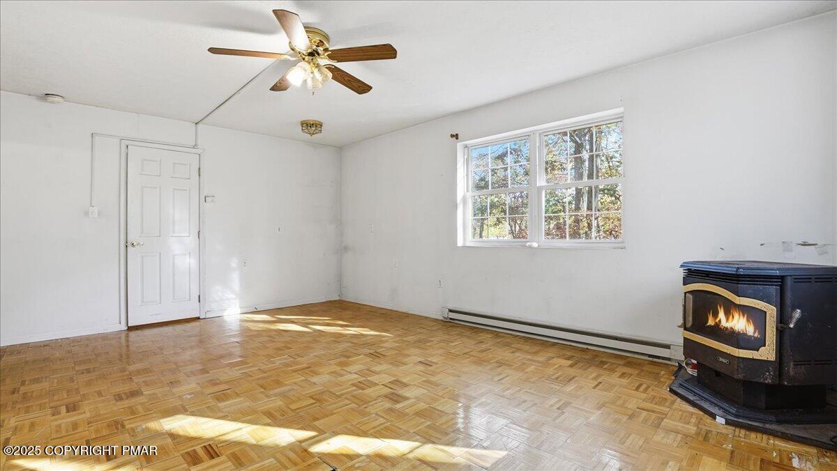 349 Bumble Bee Pass Cresco, PA 18326 - Photo 58 of 109 a view of an empty room with window and chandelier fan
