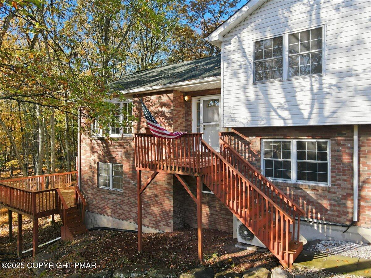 349 Bumble Bee Pass Cresco, PA 18326 - Photo 7 of 109 a view of a house with backyard and deck
