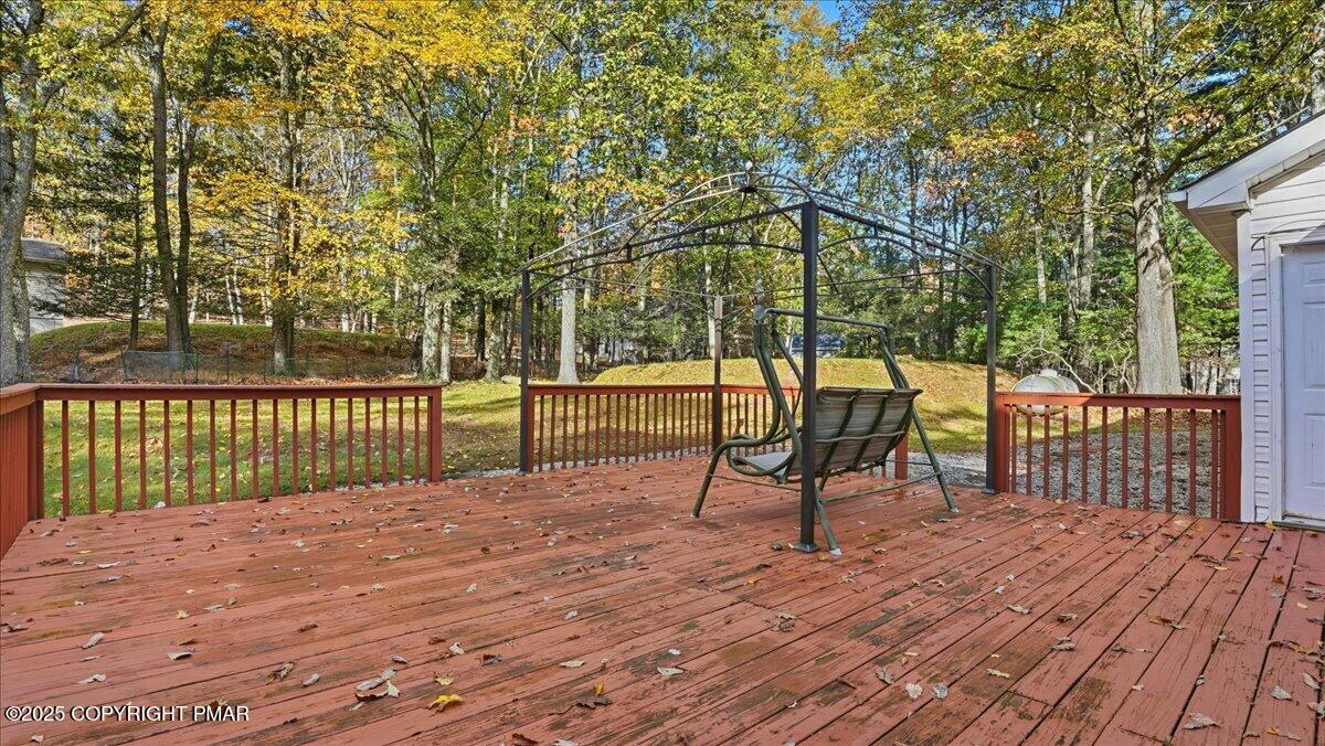 349 Bumble Bee Pass Cresco, PA 18326 - Photo 95 of 109 a view of a deck with a backyard