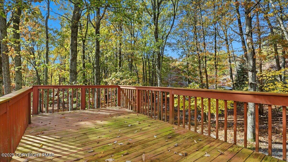 349 Bumble Bee Pass Cresco, PA 18326 - Photo 98 of 109 a balcony with wooden floor and fence