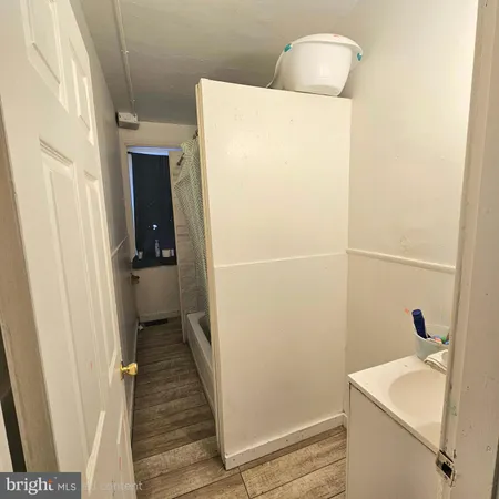 a bathroom with a sink and a shower