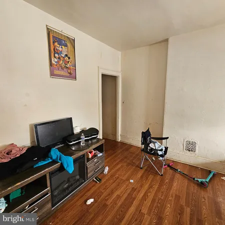 a room with furniture and wooden floor