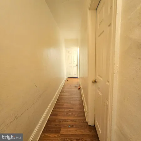a view of a bathroom with wooden floor