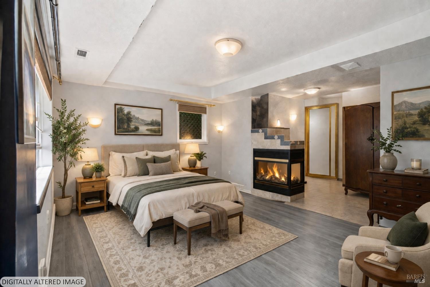 11910 Graton Road Sebastopol, CA 95472 - Photo 46 of 81 a spacious bedroom with a bed a mirror and a flat tv screen on dresser