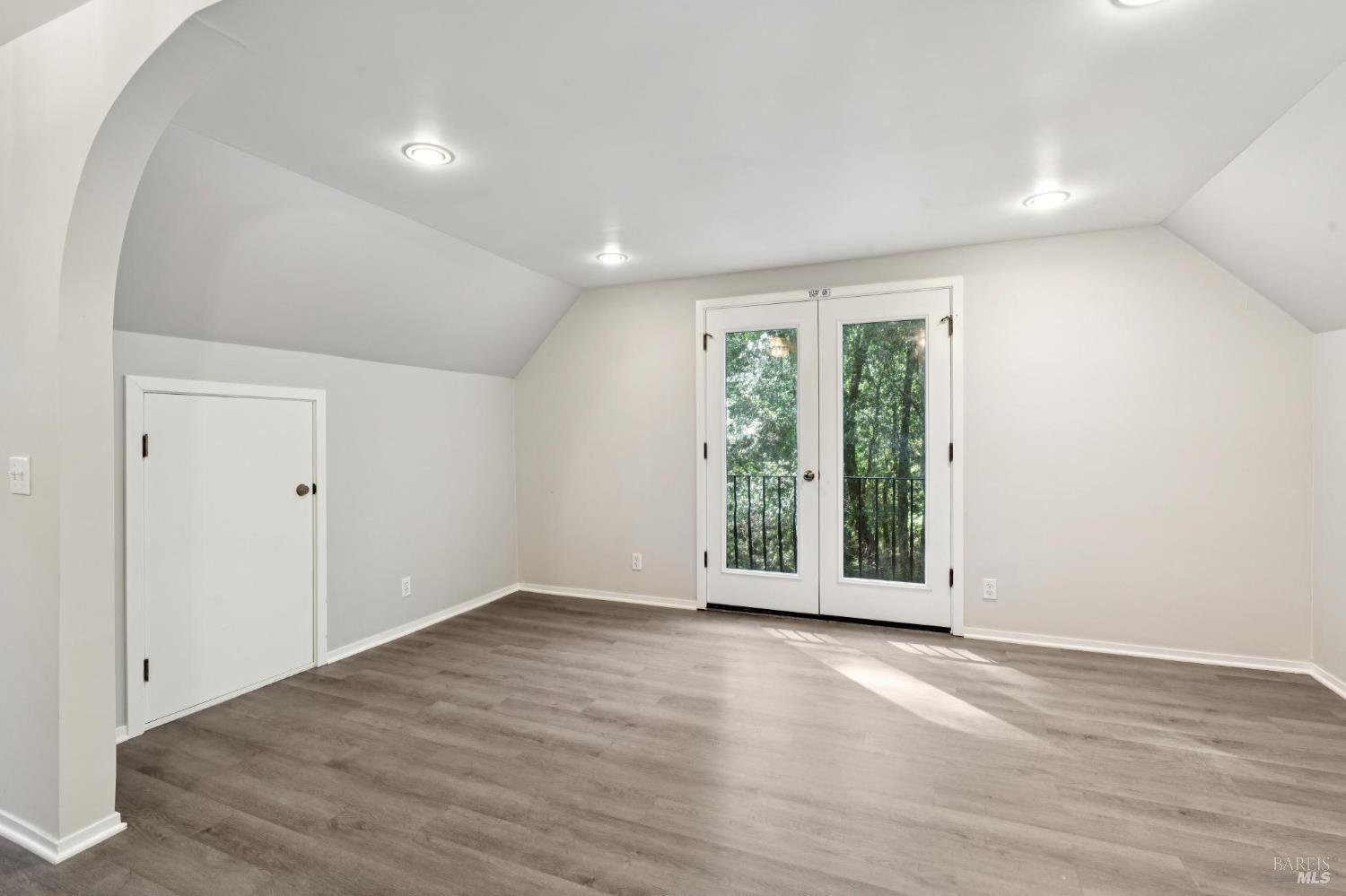 11910 Graton Road Sebastopol, CA 95472 - Photo 56 of 81 an empty room with wooden floor and windows