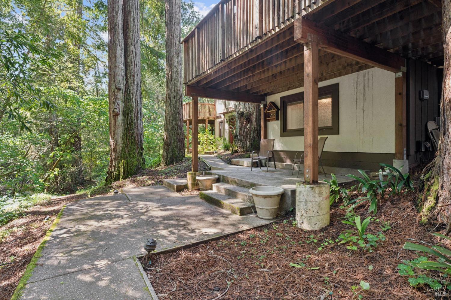 11910 Graton Road Sebastopol, CA 95472 - Photo 66 of 81 a view of a chair and table in backyard of the house