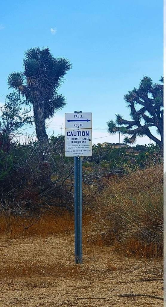 56200 Skyline Ranch Road Yucca Valley, CA 92284 - Photo 10 of 12 a sign board with a lake view