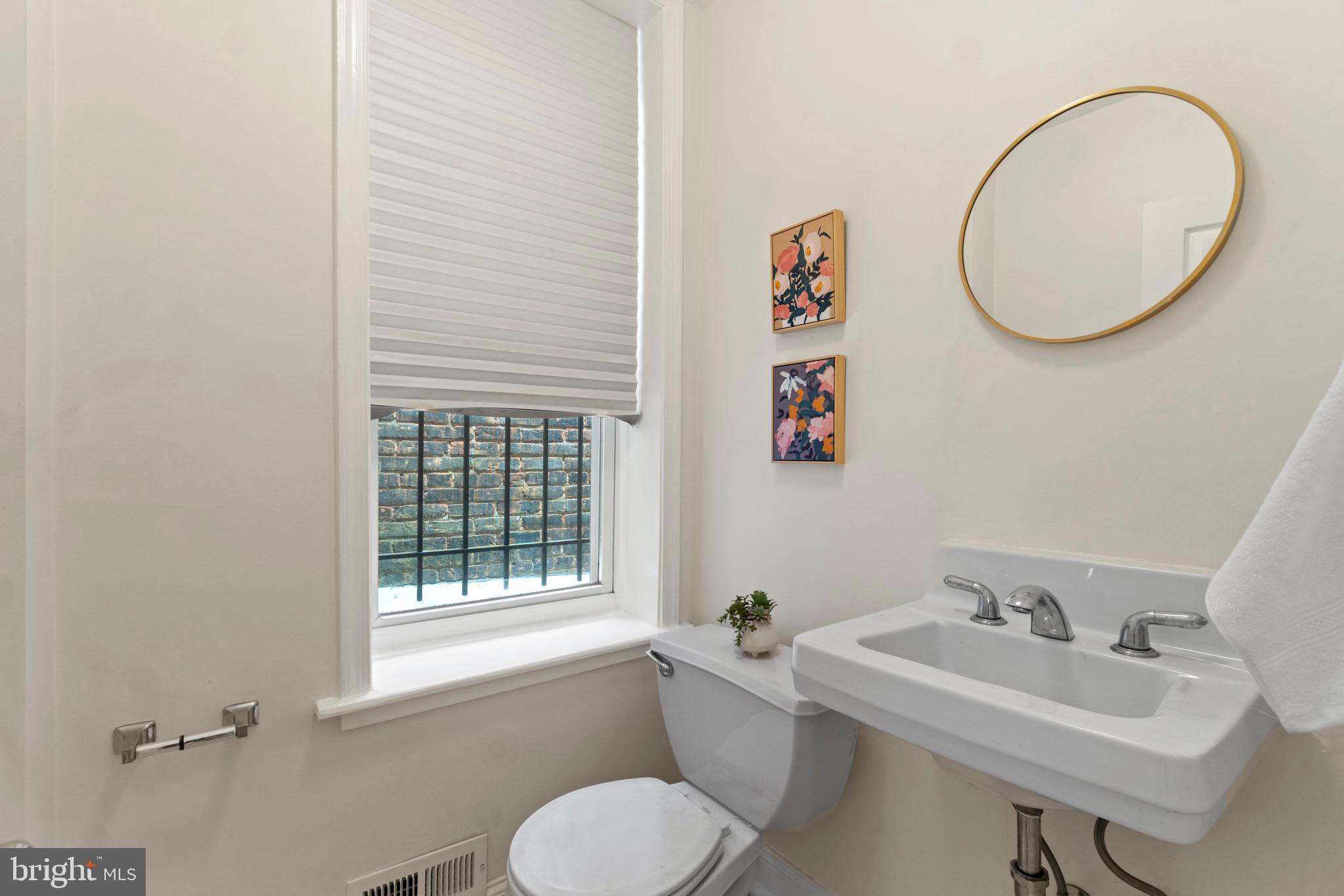 1017 Monroe Street Northwest, Unit 2 Washington, DC 20010 - Photo 9 of 19 Half bath on main level.