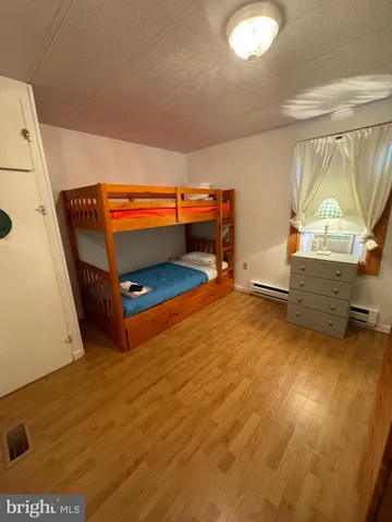 a bathroom with a sink a toilet and shower curtain