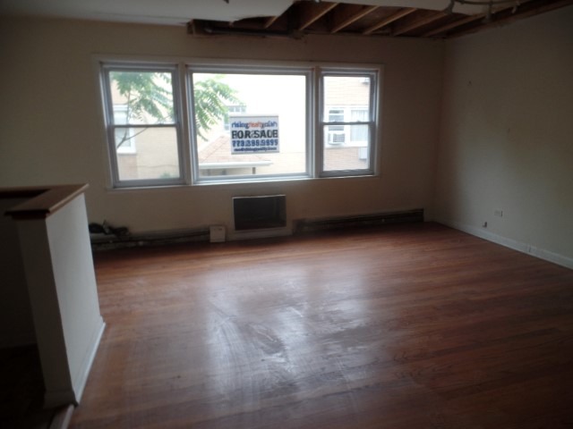 6028 South Archer Road, Unit 2 Summit, IL 60501 - Photo 3 of 6 a view of an empty room with a window