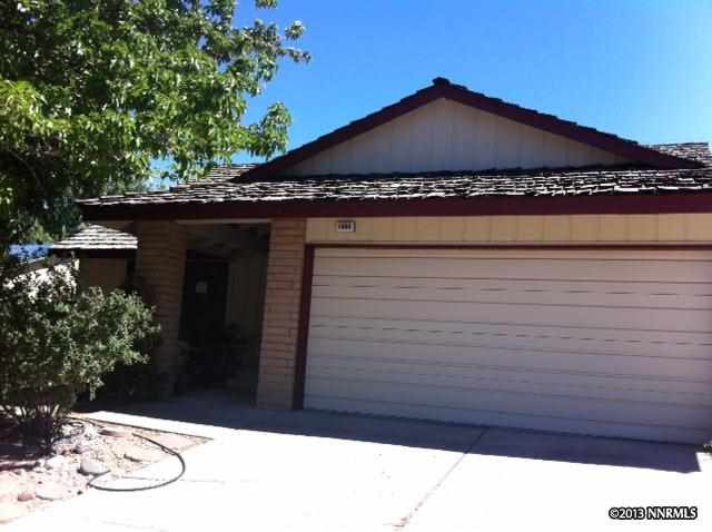 1880 Kings Row Reno, NV 89503 - Photo 1 of 1 a black and white building with trees in the background