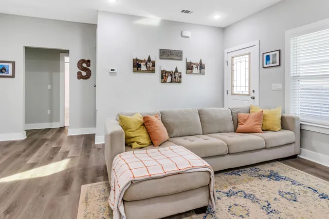 a living room with furniture and a window