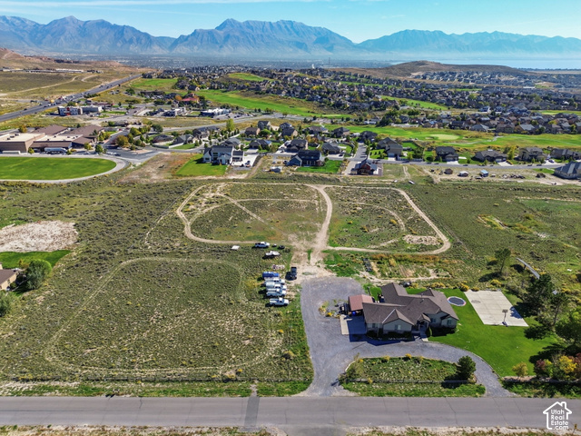 9044 North Cedar Pass Road Eagle Mountain, UT 84005 - Photo 58 of 63 Expansive property featuring a single-story residence, asphalt driveway, basketball court, and manicured lawn