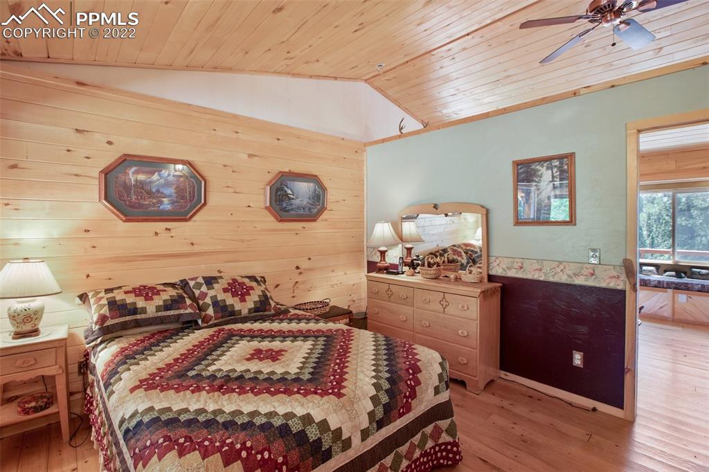 7199 Cedar Mountain Road Divide, CO 80814 - Photo 16 of 34 a bedroom with a bed and a table in it