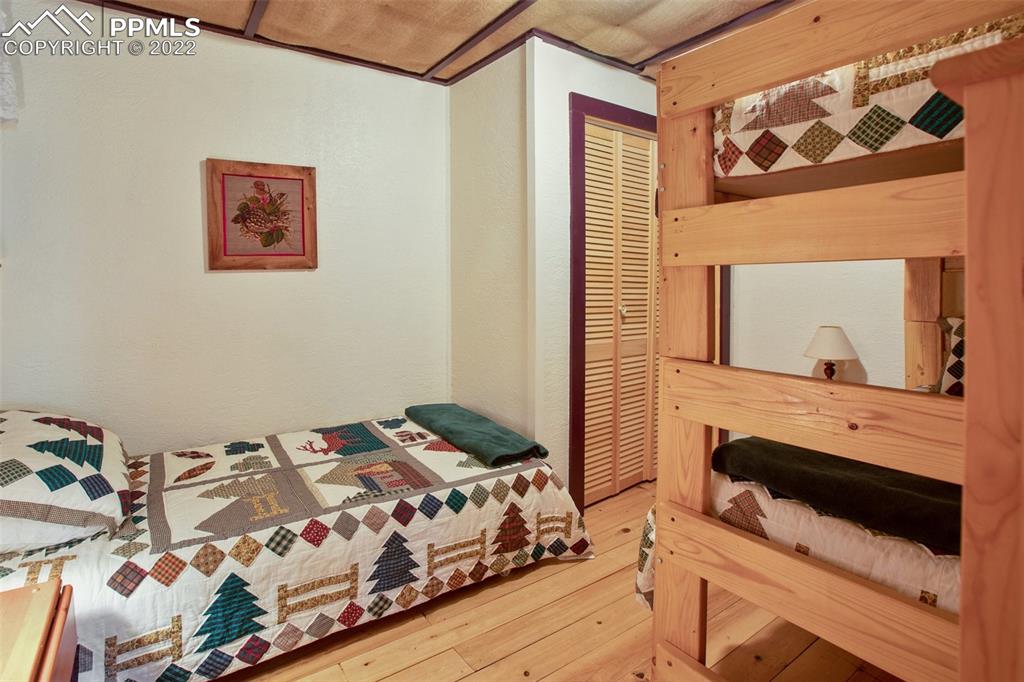 7199 Cedar Mountain Road Divide, CO 80814 - Photo 20 of 34 a bedroom with a bed and a dresser