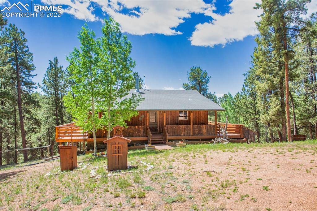 7199 Cedar Mountain Road Divide, CO 80814 - Photo 2 of 34 a view of a house with a yard