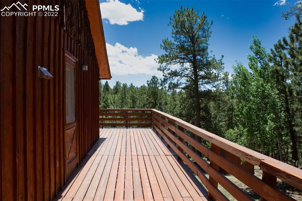 7199 Cedar Mountain Road Divide, CO 80814 - Photo 6 of 34 a view of balcony with wooden floor