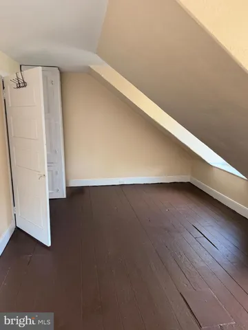 a view of room with wooden floor