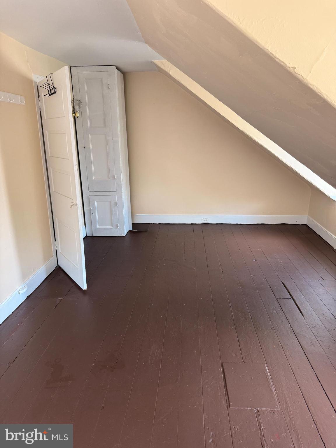 105 West Broadway, Unit C Salem, NJ 08079 - Photo 22 of 26 an empty room with wooden floor and entrance