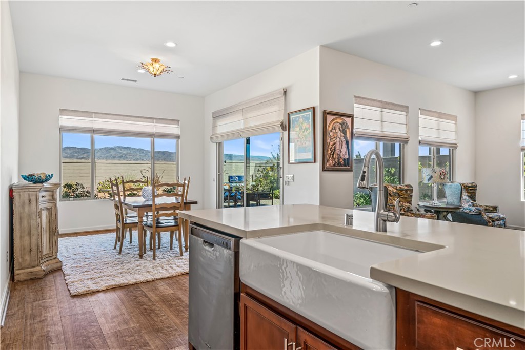 82 Prosecco Rancho Mirage, CA 92270 - Photo 11 of 56 a view of a dining room with furniture large windows and wooden floor