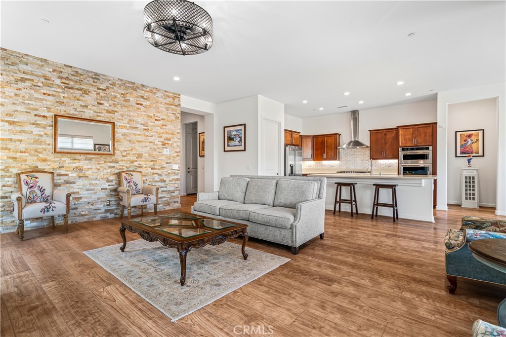 82 Prosecco Rancho Mirage, CA 92270 - Photo 12 of 56 a living room with furniture and kitchen view