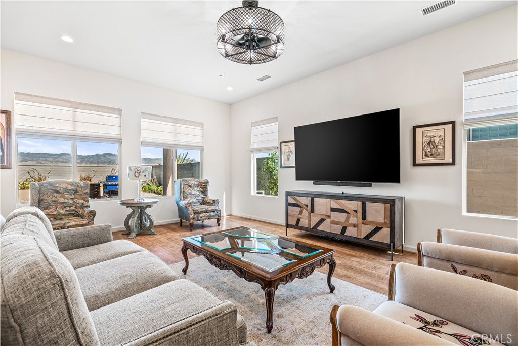82 Prosecco Rancho Mirage, CA 92270 - Photo 13 of 56 a living room with furniture and a flat screen tv