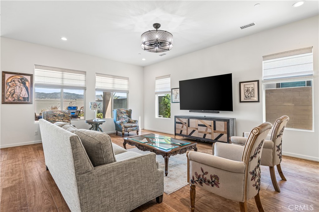 82 Prosecco Rancho Mirage, CA 92270 - Photo 14 of 56 a living room with furniture and a flat screen tv