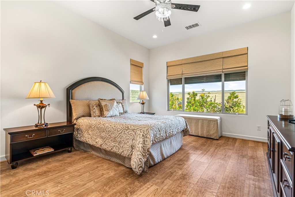 82 Prosecco Rancho Mirage, CA 92270 - Photo 19 of 56 a bedroom with a bed and a window