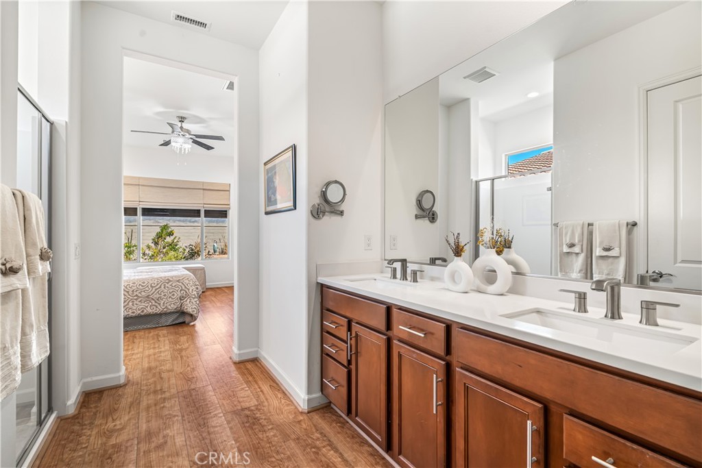 82 Prosecco Rancho Mirage, CA 92270 - Photo 20 of 56 a en suite bathroom with a double vanity sink and mirror