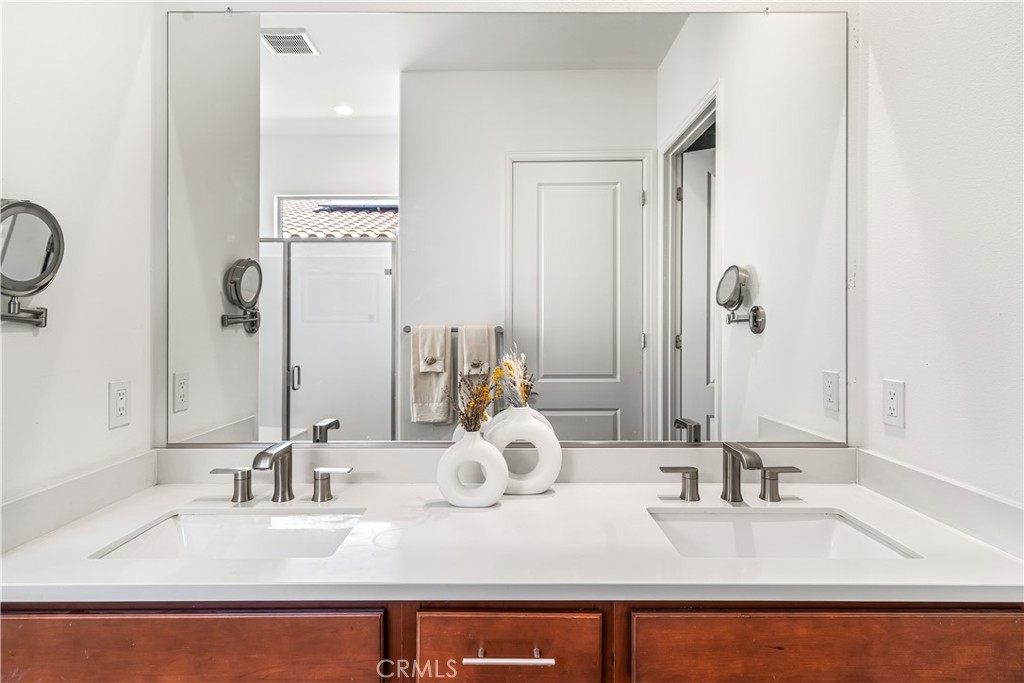 82 Prosecco Rancho Mirage, CA 92270 - Photo 21 of 56 a bathroom with a sink and a mirror