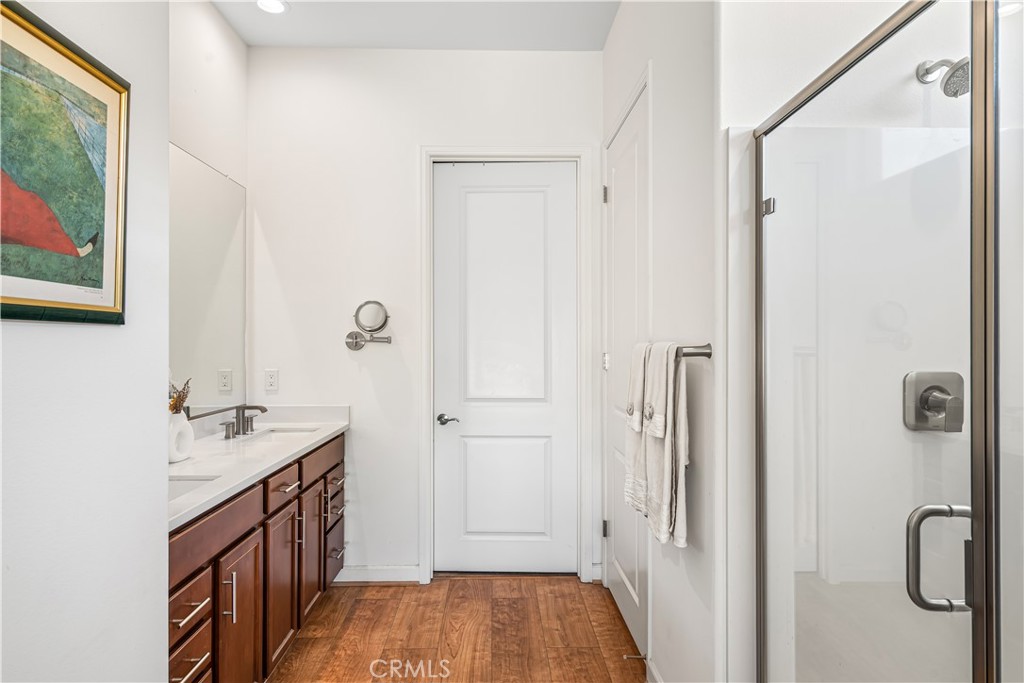 82 Prosecco Rancho Mirage, CA 92270 - Photo 22 of 56 a bathroom with a sink a mirror and a shower