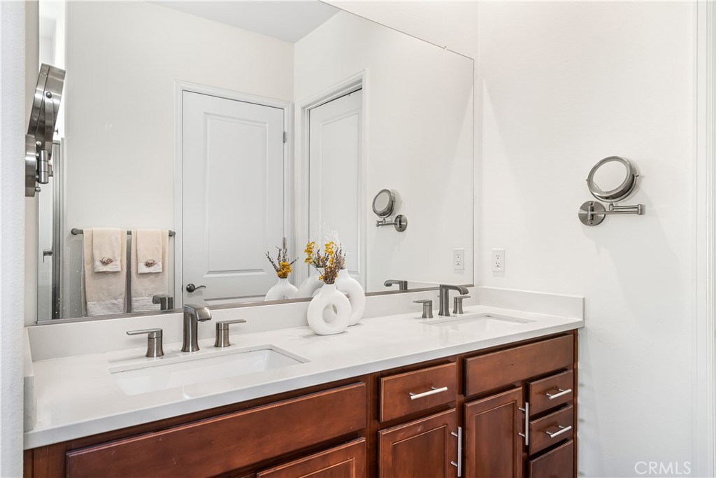 82 Prosecco Rancho Mirage, CA 92270 - Photo 23 of 56 a bathroom with a sink and a mirror