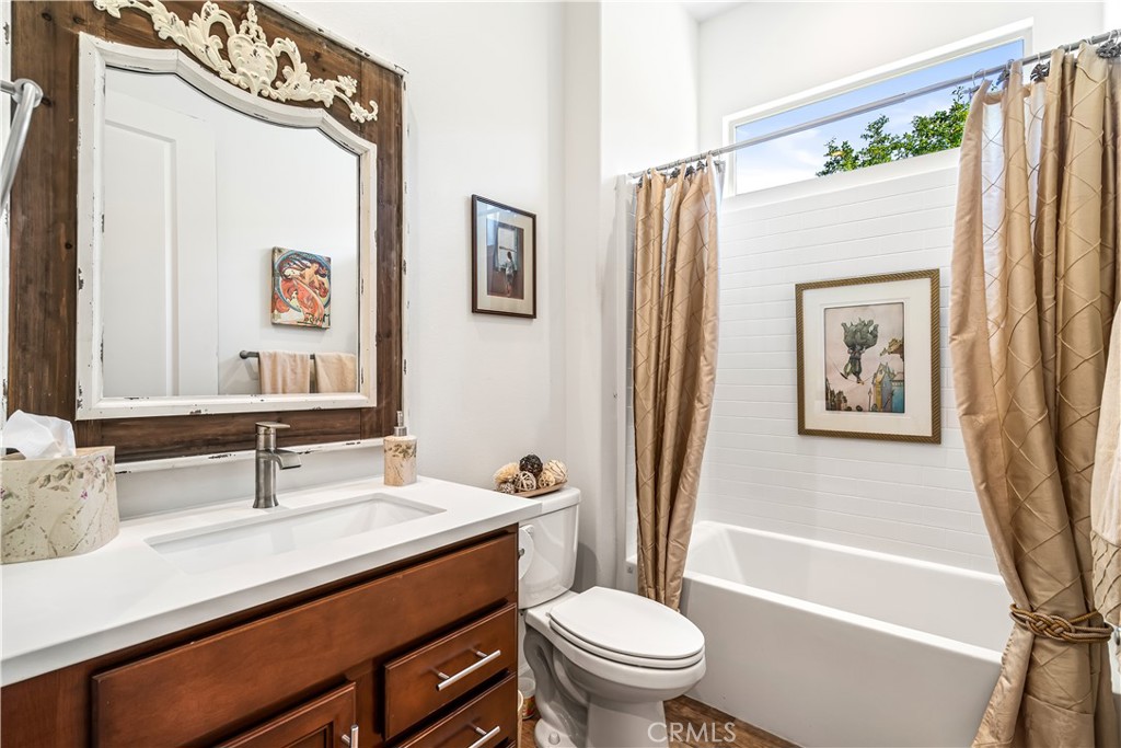 82 Prosecco Rancho Mirage, CA 92270 - Photo 28 of 56 a bathroom with a sink a toilet and a bathtub