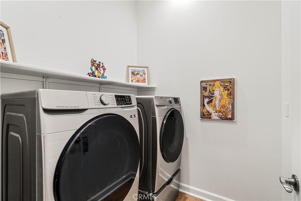 82 Prosecco Rancho Mirage, CA 92270 - Photo 30 of 56 a utility room with dryer and washer