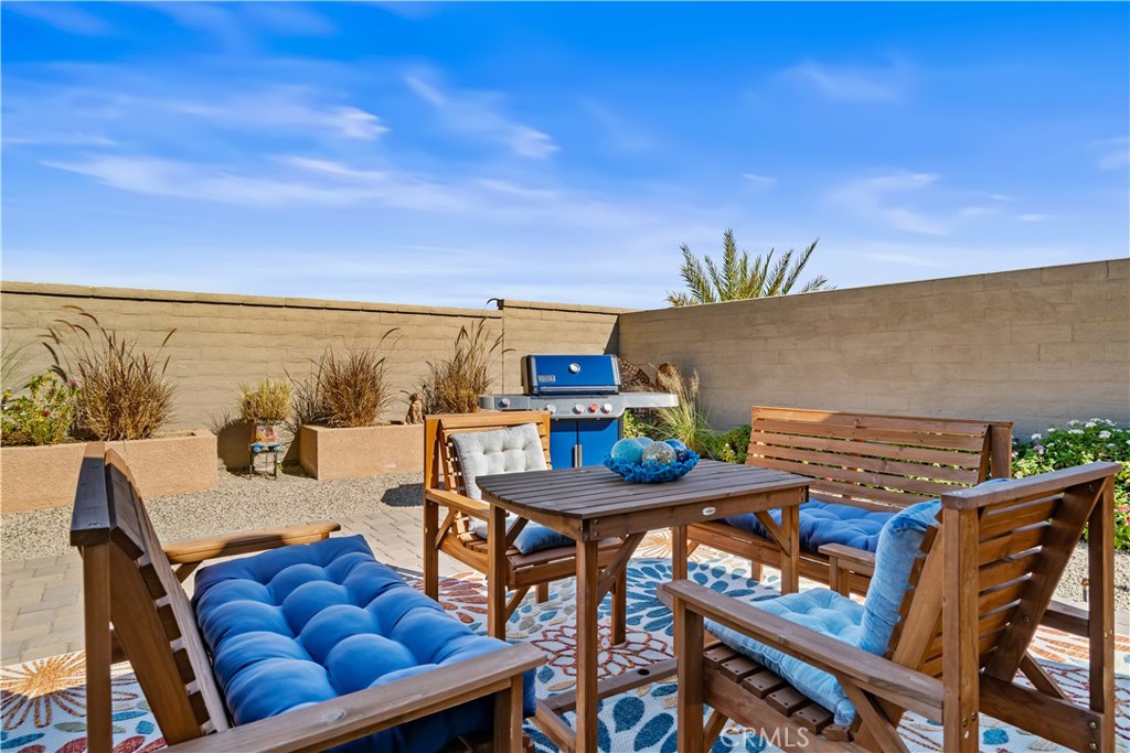 82 Prosecco Rancho Mirage, CA 92270 - Photo 33 of 56 a terrace of a house with outdoor seating