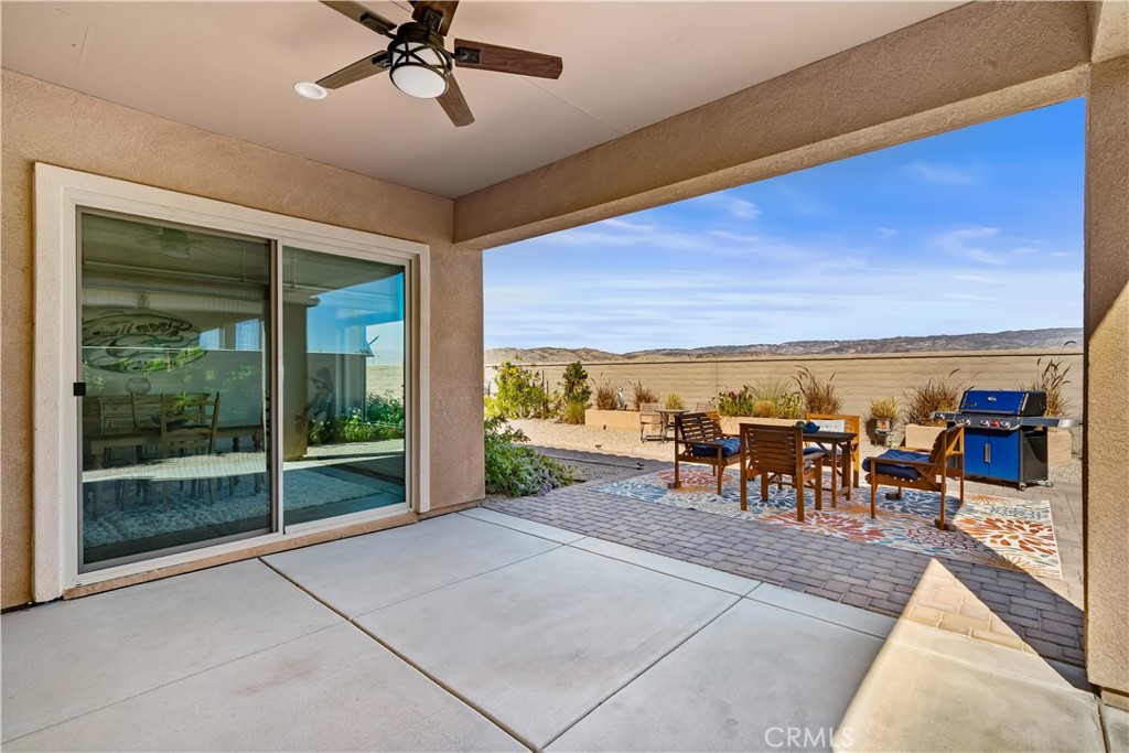 82 Prosecco Rancho Mirage, CA 92270 - Photo 38 of 56 a view of a patio with a table and chairs