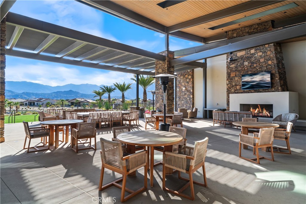 82 Prosecco Rancho Mirage, CA 92270 - Photo 40 of 56 a view of a patio with a table and chairs