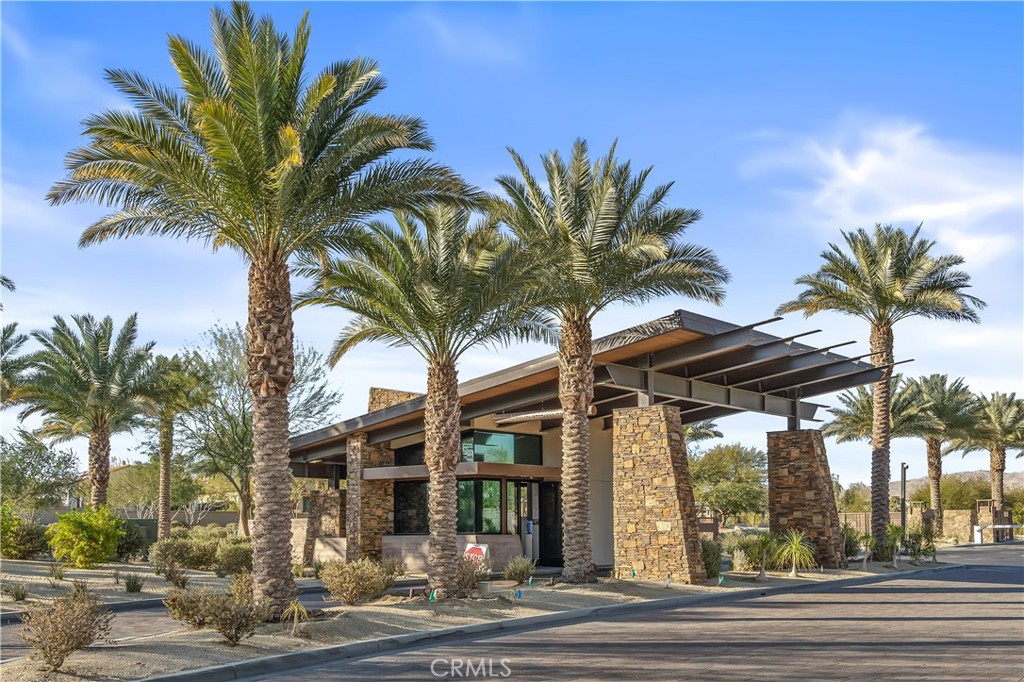 82 Prosecco Rancho Mirage, CA 92270 - Photo 55 of 56 a view of a palm trees front of the house