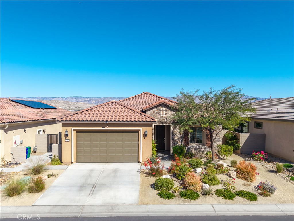 82 Prosecco Rancho Mirage, CA 92270 - Photo 56 of 56 a front view of a house with a yard