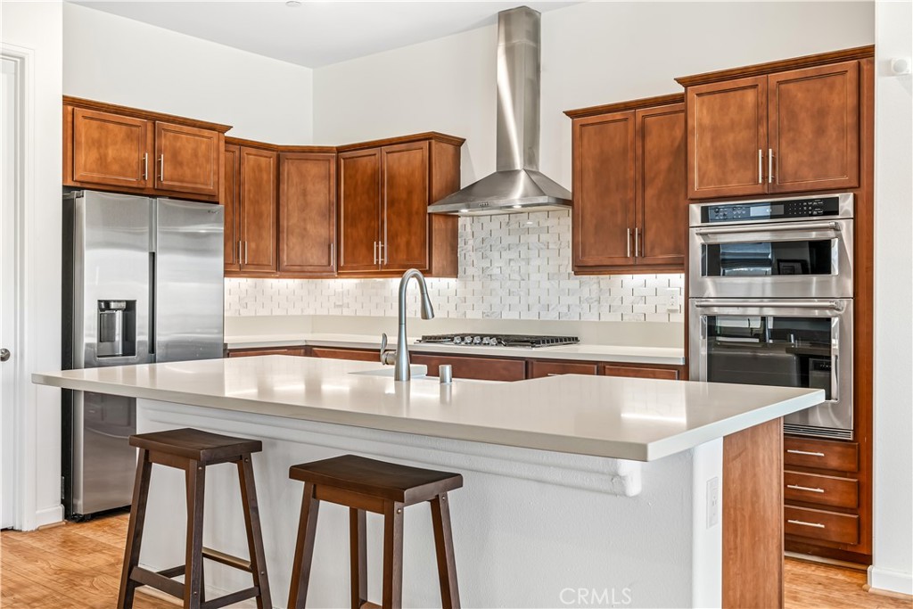 82 Prosecco Rancho Mirage, CA 92270 - Photo 8 of 56 a kitchen with stainless steel appliances a sink and cabinets