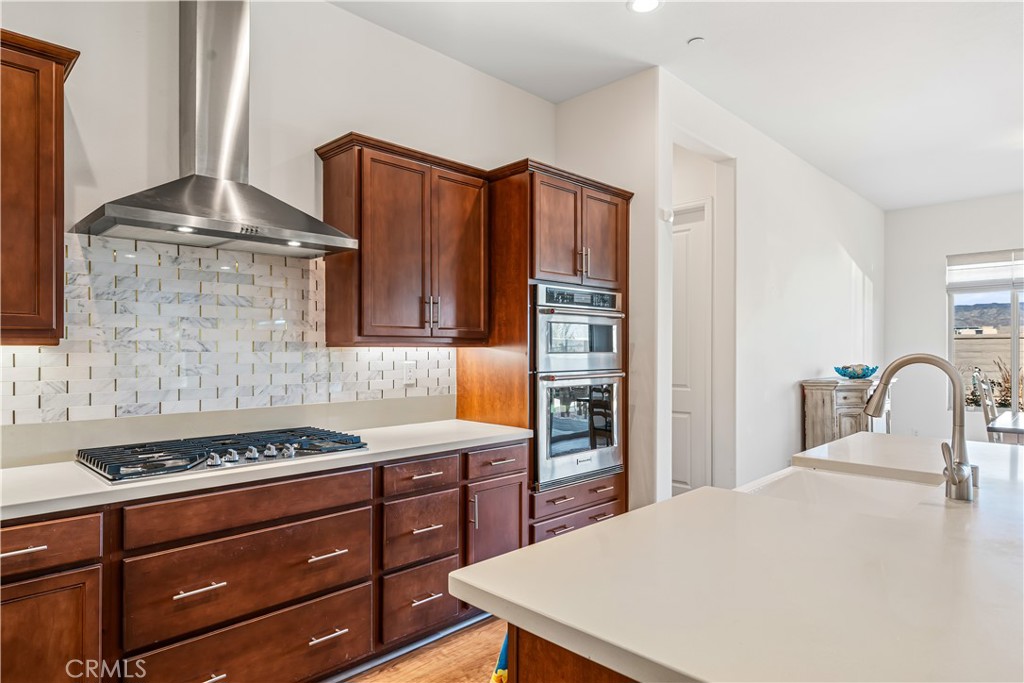 82 Prosecco Rancho Mirage, CA 92270 - Photo 9 of 56 a kitchen with granite countertop a stove cabinets and appliances