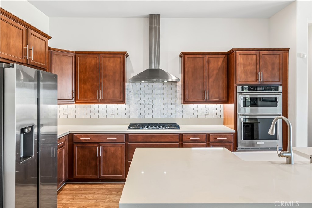 82 Prosecco Rancho Mirage, CA 92270 - Photo 10 of 56 a kitchen with stainless steel appliances granite countertop a refrigerator and a stove top oven