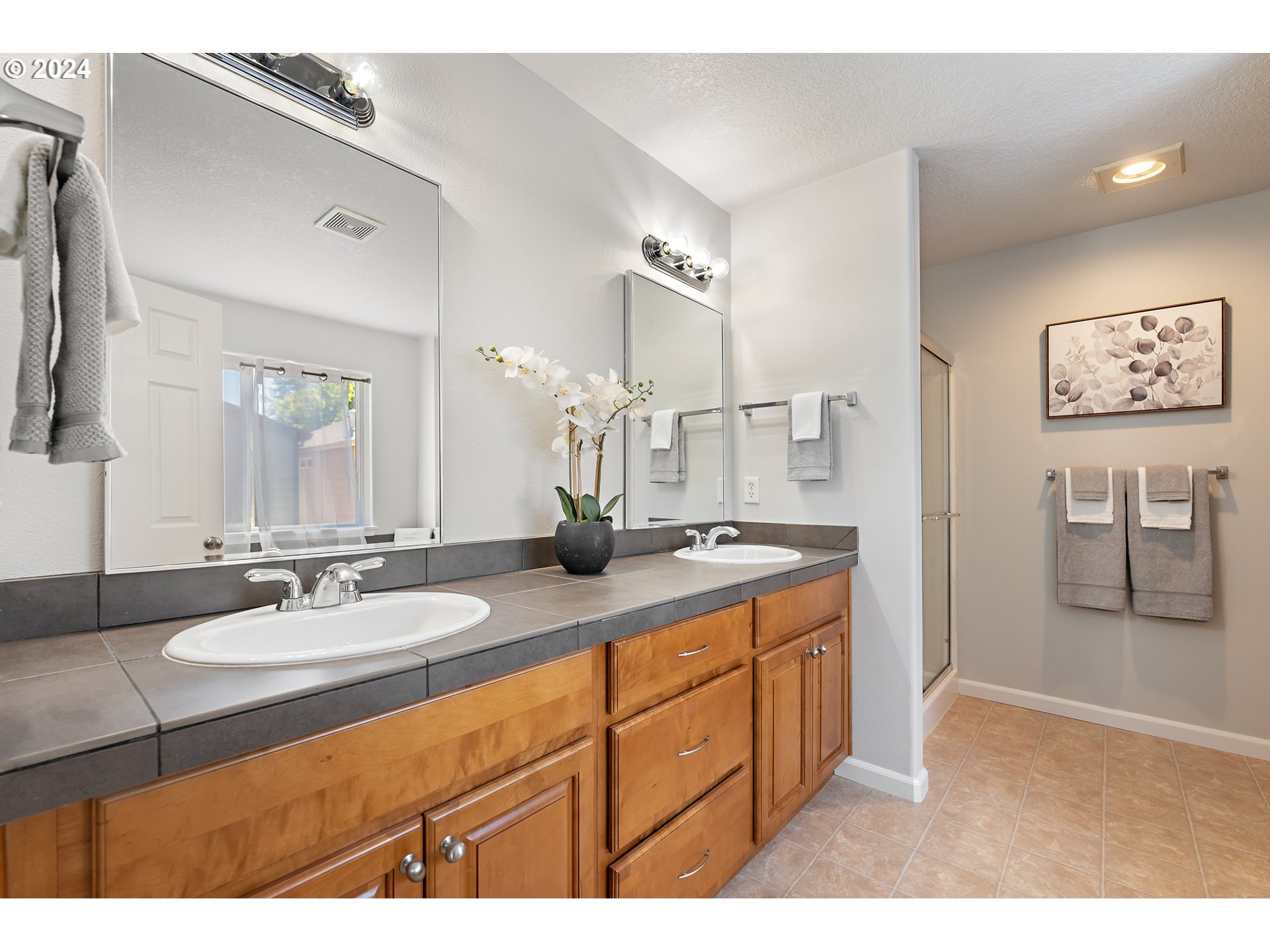 3149 Southwest 173rd Avenue Beaverton, OR 97003 - Photo 18 of 35 a bathroom with a sink double vanity granite and a mirror