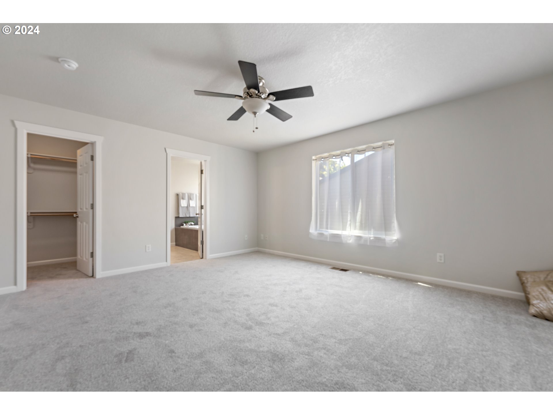 3149 Southwest 173rd Avenue Beaverton, OR 97003 - Photo 21 of 35 a view of an empty room with a window