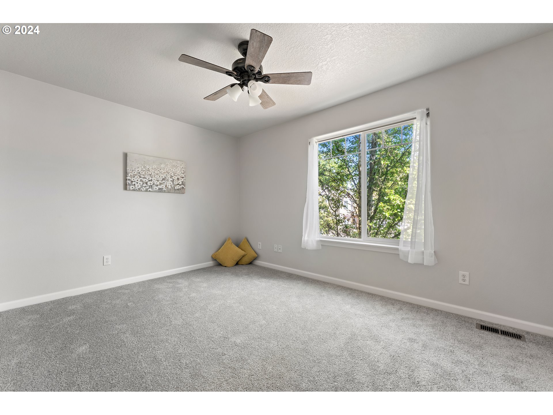 3149 Southwest 173rd Avenue Beaverton, OR 97003 - Photo 22 of 35 a view of a livingroom with a ceiling fan and window