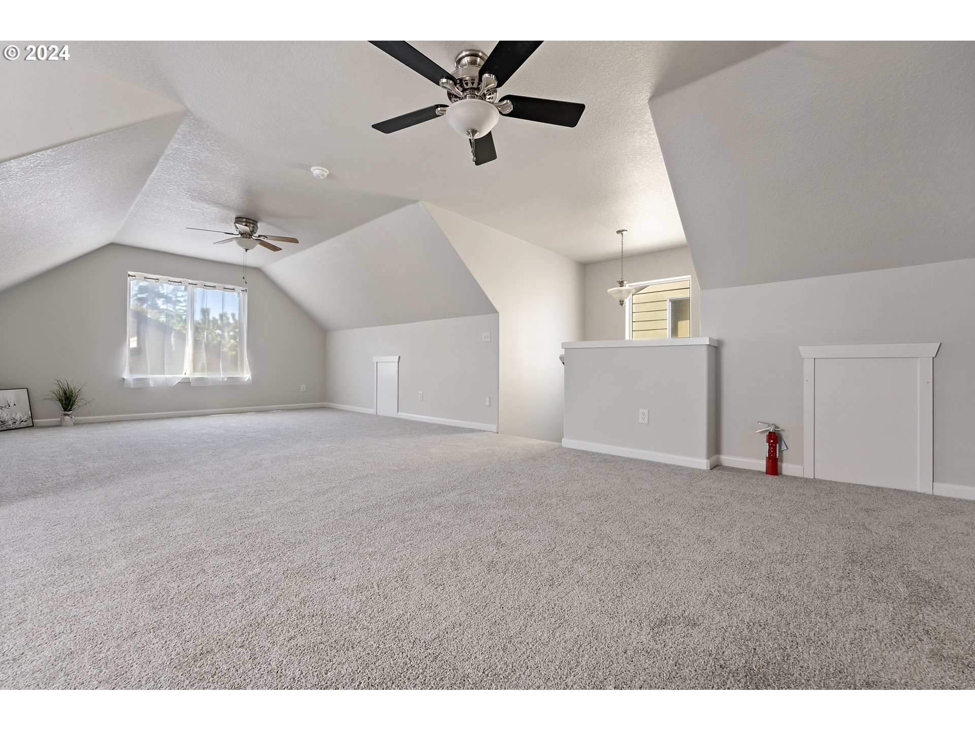 3149 Southwest 173rd Avenue Beaverton, OR 97003 - Photo 27 of 35 a view of a livingroom with a ceiling fan and window