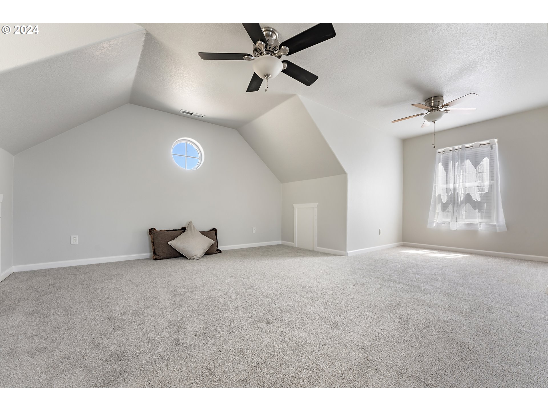 3149 Southwest 173rd Avenue Beaverton, OR 97003 - Photo 28 of 35 a view of a livingroom with a ceiling fan and window