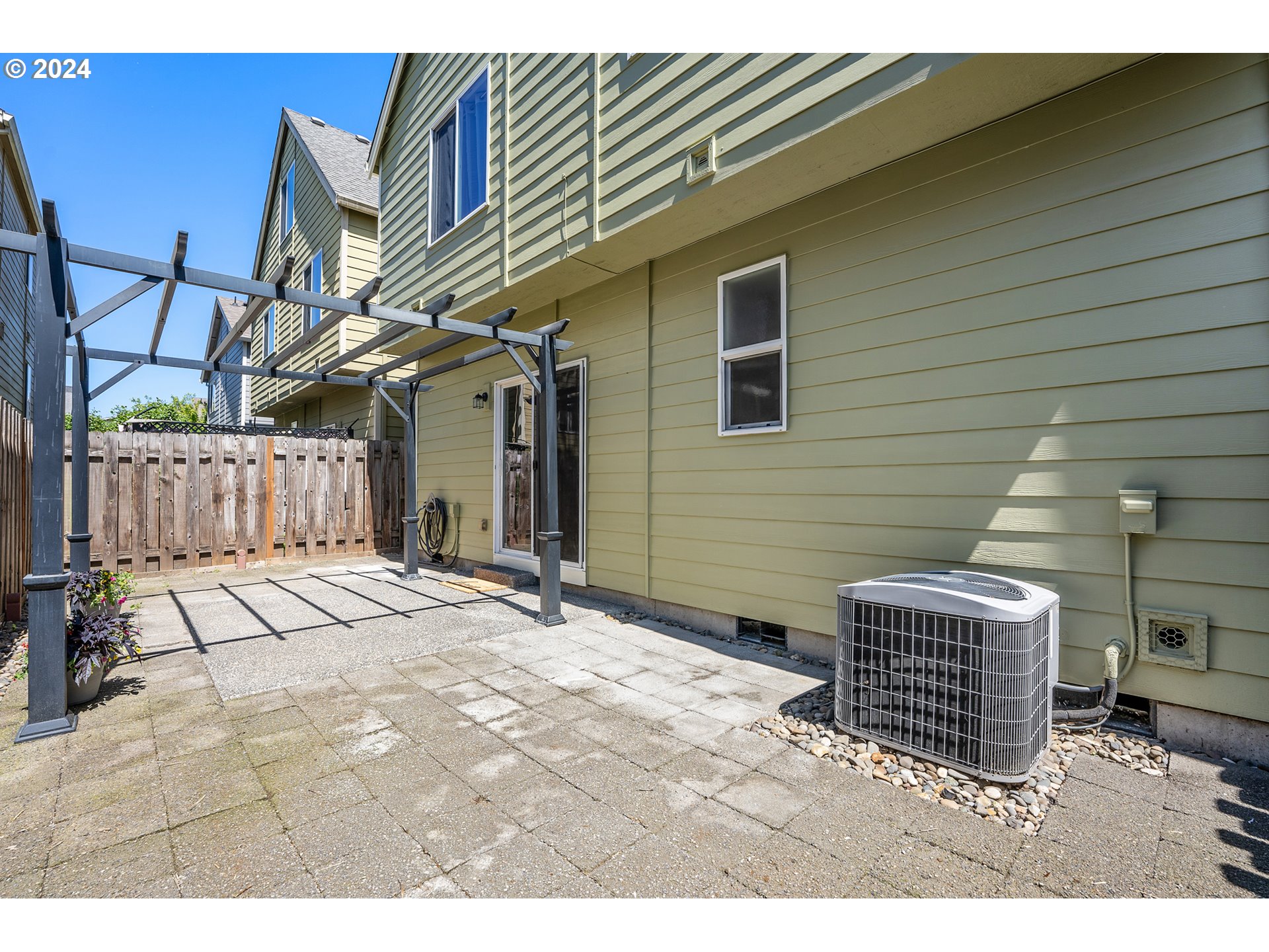 3149 Southwest 173rd Avenue Beaverton, OR 97003 - Photo 30 of 35 a backyard of a house with barbeque and wooden fence