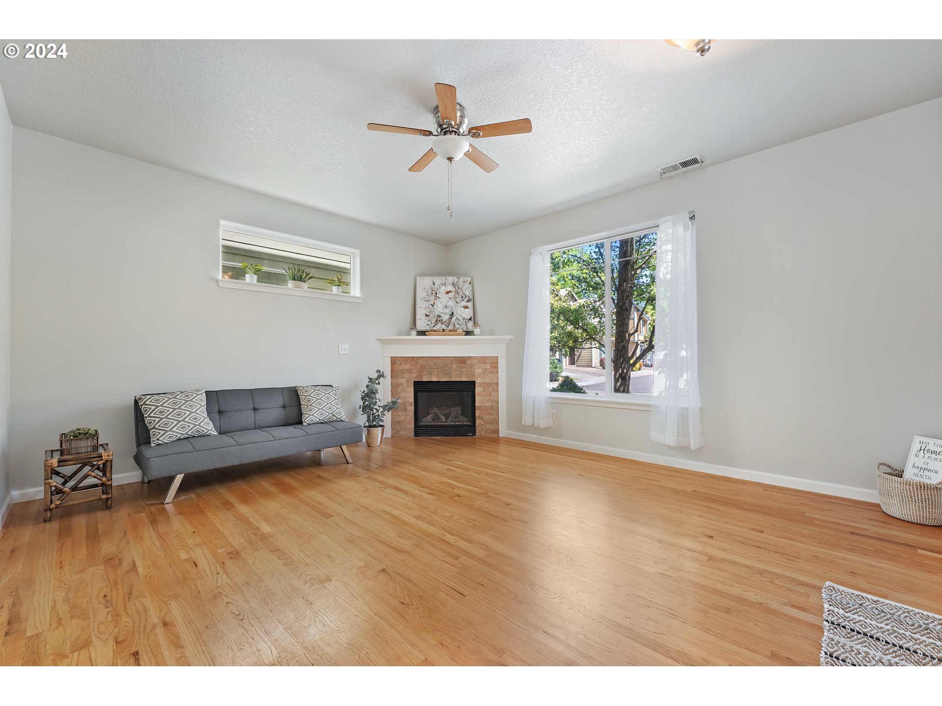 3149 Southwest 173rd Avenue Beaverton, OR 97003 - Photo 3 of 35 a living room with furniture and a fireplace